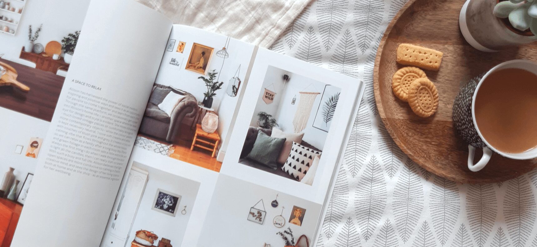 A book with pictures of a living room and dining area.